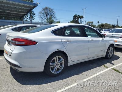 Trzecie zdjęcie samochodu z tyłu: 2018 FORD FUSION SE HYBRID VIN:3FA6P0LU7JR278731 - miniatura