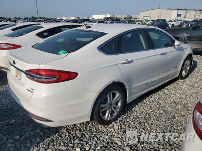 Trzecie zdjęcie samochodu z tyłu: 2018 FORD FUSION SE HYBRID VIN:3FA6P0LU6JR129890 - miniatura
