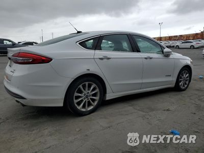 Trzecie zdjęcie samochodu z tyłu: 2017 FORD FUSION SE HYBRID VIN:3FA6P0LU2HR409753 - miniatura
