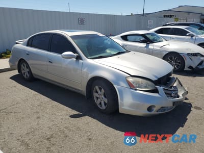Czwarte zdjęcie samochodu z boku: 2003 NISSAN ALTIMA BASE VIN:1N4AL11E13C242591 - miniatura