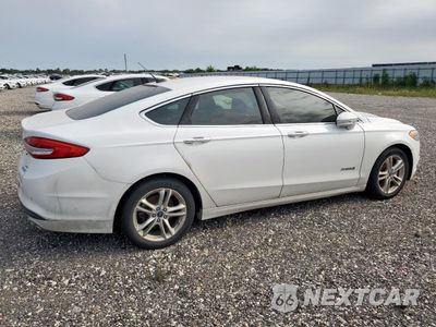 Trzecie zdjęcie samochodu z tyłu: 2018 FORD FUSION SE HYBRID VIN:3FA6P0LU1JR171674 - miniatura