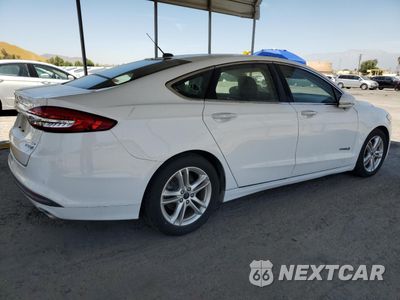 Trzecie zdjęcie samochodu z tyłu: 2018 FORD FUSION SE HYBRID VIN:3FA6P0LU9JR172121 - miniatura