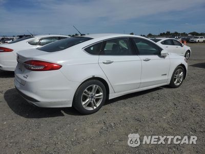 Trzecie zdjęcie samochodu z tyłu: 2018 FORD FUSION SE HYBRID VIN:3FA6P0LU3JR171868 - miniatura
