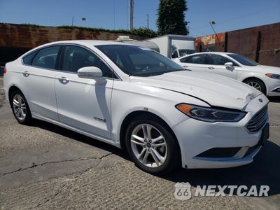 Czwarte zdjęcie samochodu z boku: 2018 FORD FUSION SE HYBRID VIN:3FA6P0LU5JR172116 - miniatura