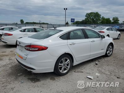 Trzecie zdjęcie samochodu z tyłu: 2018 FORD FUSION SE HYBRID VIN:3FA6P0LU2JR172090 - miniatura