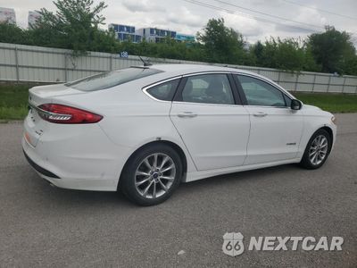 Trzecie zdjęcie samochodu z tyłu: 2017 FORD FUSION SE HYBRID VIN:3FA6P0LU4HR409091 - miniatura
