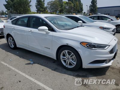 Czwarte zdjęcie samochodu z boku: 2018 FORD FUSION SE HYBRID VIN:3FA6P0LUXJR172130 - miniatura