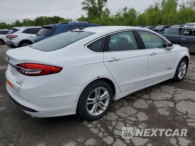 Trzecie zdjęcie samochodu z tyłu: 2018 FORD FUSION SE HYBRID VIN:3FA6P0LUXJR172001 - miniatura