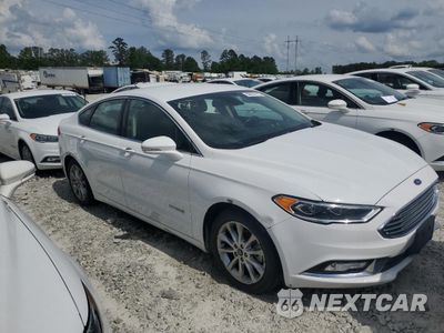 Czwarte zdjęcie samochodu z boku: 2017 FORD FUSION SE HYBRID VIN:3FA6P0LUXHR359667 - miniatura