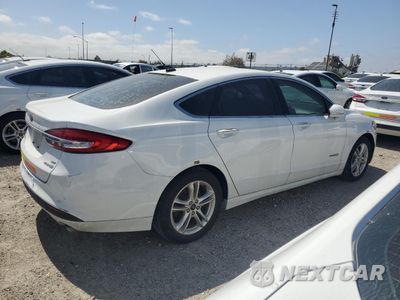 Trzecie zdjęcie samochodu z tyłu: 2018 FORD FUSION SE HYBRID VIN:3FA6P0LU1JR278613 - miniatura