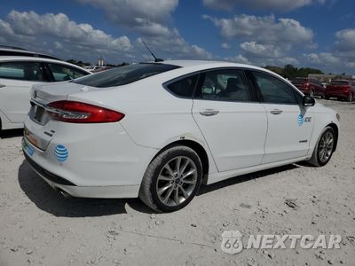Trzecie zdjęcie samochodu z tyłu: 2017 FORD FUSION SE HYBRID VIN:3FA6P0LU6HR409416 - miniatura