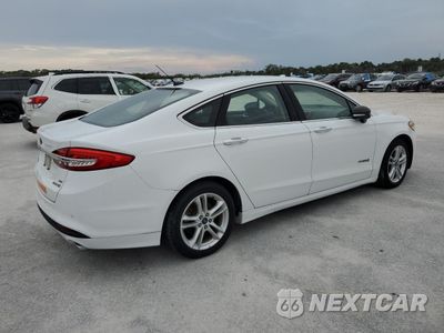 Trzecie zdjęcie samochodu z tyłu: 2018 FORD FUSION SE HYBRID VIN:3FA6P0LU4JR118614 - miniatura