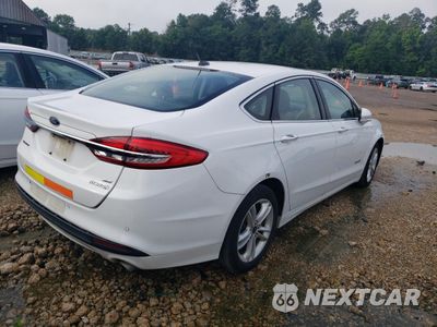 Trzecie zdjęcie samochodu z tyłu: 2018 FORD FUSION SE HYBRID VIN:3FA6P0LU0JR281888 - miniatura