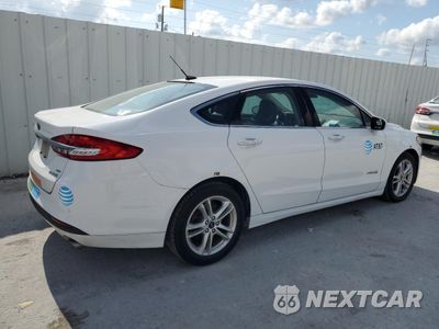 Trzecie zdjęcie samochodu z tyłu: 2018 FORD FUSION SE HYBRID VIN:3FA6P0LU6JR281894 - miniatura