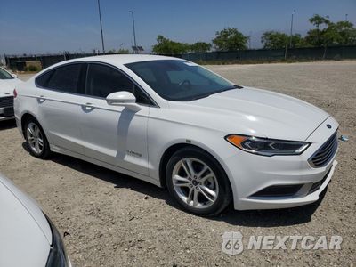 Czwarte zdjęcie samochodu z boku: 2018 FORD FUSION SE HYBRID VIN:3FA6P0LU6JR129842 - miniatura