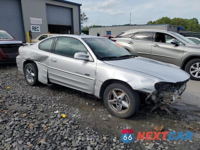 Czwarte zdjęcie samochodu z boku: 2001 PONTIAC GRAND AM GT1 VIN:1G2NV12E51C276944 - miniatura