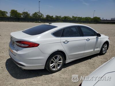 Trzecie zdjęcie samochodu z tyłu: 2018 FORD FUSION SE HYBRID VIN:3FA6P0LU6JR129842 - miniatura
