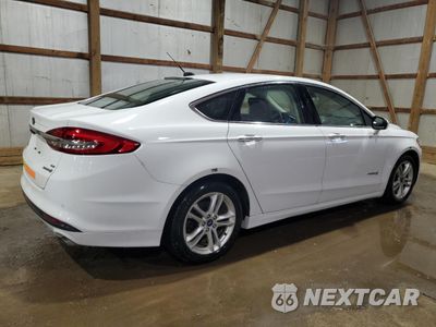 Trzecie zdjęcie samochodu z tyłu: 2018 FORD FUSION SE HYBRID VIN:3FA6P0LU6JR118842 - miniatura
