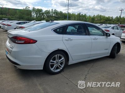 Trzecie zdjęcie samochodu z tyłu: 2018 FORD FUSION SE HYBRID VIN:3FA6P0LU2JR172042 - miniatura