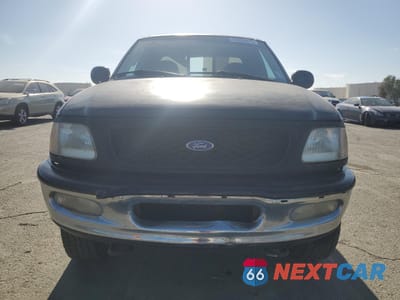 Piąte zdjęcie samochodu w środku: 1997 FORD F150 VIN:1FTEX18L0VKD52416 - miniatura