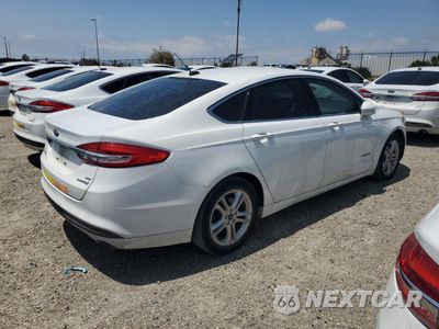 Trzecie zdjęcie samochodu z tyłu: 2018 FORD FUSION SE HYBRID VIN:3FA6P0LU2JR171571 - miniatura