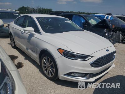 Czwarte zdjęcie samochodu z boku: 2017 FORD FUSION SE HYBRID VIN:3FA6P0LU9HR409555 - miniatura