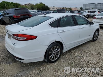 Trzecie zdjęcie samochodu z tyłu: 2017 FORD FUSION SE HYBRID VIN:3FA6P0LU7HR409473 - miniatura