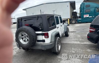 Czwarte zdjęcie samochodu z boku: 2013 JEEP WRANGLER UNLIMITED SPORT VIN:1C4BJWDG6DL582321 - miniatura