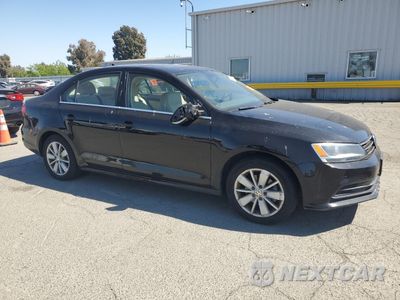 Czwarte zdjęcie samochodu z boku: 2015 VOLKSWAGEN JETTA SE VIN:3VWD17AJXFM232896 - miniatura