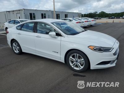 Czwarte zdjęcie samochodu z boku: 2018 FORD FUSION SE HYBRID VIN:3FA6P0LU8JR178475 - miniatura