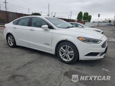 Czwarte zdjęcie samochodu z boku: 2018 FORD FUSION SE HYBRID VIN:3FA6P0LU7JR171713 - miniatura