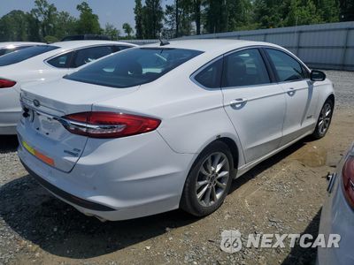 Trzecie zdjęcie samochodu z tyłu: 2017 FORD FUSION SE HYBRID VIN:3FA6P0LU1HR359654 - miniatura