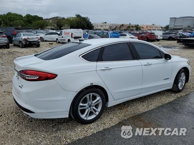Trzecie zdjęcie samochodu z tyłu: 2018 FORD FUSION SE HYBRID VIN:3FA6P0LUXJR278710 - miniatura