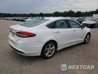 Trzecie zdjęcie samochodu z tyłu: 2018 FORD FUSION SE HYBRID VIN:3FA6P0LU1JR171996 - miniatura