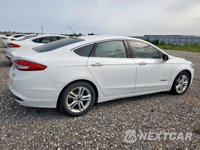 Trzecie zdjęcie samochodu z tyłu: 2018 FORD FUSION SE HYBRID VIN:3FA6P0LU5JR171628 - miniatura