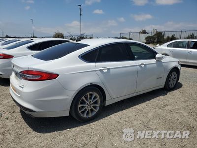 Trzecie zdjęcie samochodu z tyłu: 2017 FORD FUSION SE HYBRID VIN:3FA6P0LUXHR409709 - miniatura