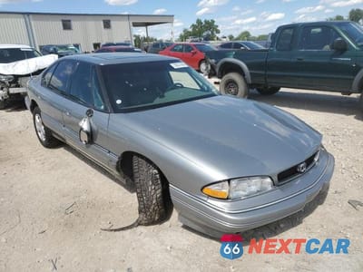 Czwarte zdjęcie samochodu z boku: 1993 PONTIAC BONNEVILLE SE VIN:1G2HX53L2P1272186 - miniatura