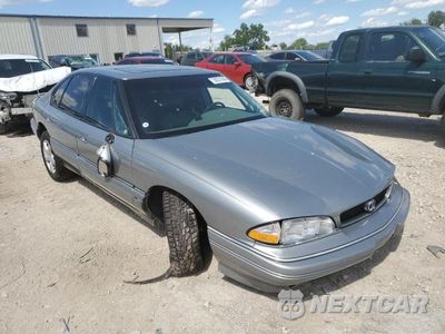Czwarte zdjęcie samochodu z boku: 1993 PONTIAC BONNEVILLE SE VIN:1G2HX53L2P1272186 - miniatura