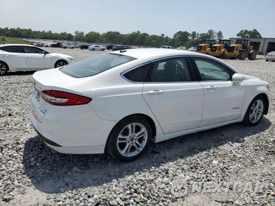 Trzecie zdjęcie samochodu z tyłu: 2018 FORD FUSION SE HYBRID VIN:3FA6P0LUXJR129911 - miniatura