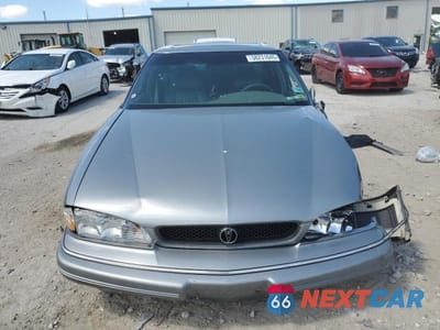 Piąte zdjęcie samochodu w środku: 1993 PONTIAC BONNEVILLE SE VIN:1G2HX53L2P1272186 - miniatura