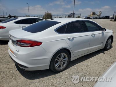Trzecie zdjęcie samochodu z tyłu: 2018 FORD FUSION SE HYBRID VIN:3FA6P0LU9JR278617 - miniatura