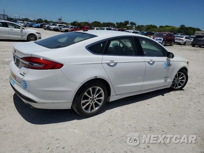 Trzecie zdjęcie samochodu z tyłu: 2017 FORD FUSION SE HYBRID VIN:3FA6P0LU7HR410140 - miniatura