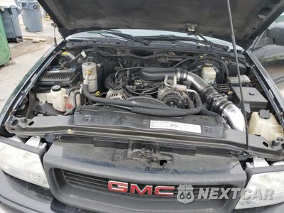 Zdjęcie 11 z 12 samochodu: 2000 GMC JIMMY VIN:1GKCS18W2YK221142 - miniatura