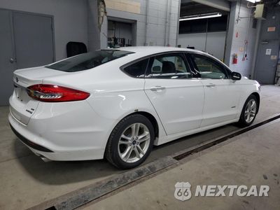 Trzecie zdjęcie samochodu z tyłu: 2018 FORD FUSION SE HYBRID VIN:3FA6P0LU0JR118738 - miniatura
