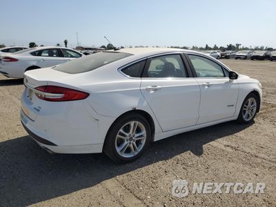 Trzecie zdjęcie samochodu z tyłu: 2018 FORD FUSION SE HYBRID VIN:3FA6P0LU5JR129959 - miniatura