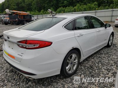 Trzecie zdjęcie samochodu z tyłu: 2018 FORD FUSION SE HYBRID VIN:3FA6P0LU6JR171766 - miniatura