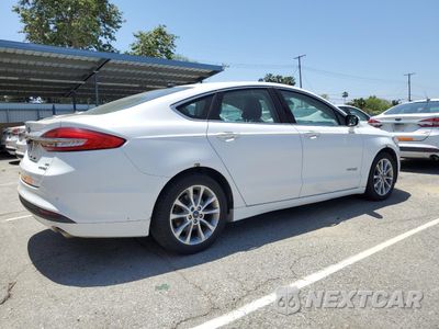 Trzecie zdjęcie samochodu z tyłu: 2017 FORD FUSION SE HYBRID VIN:3FA6P0LU9HR409684 - miniatura