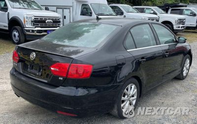 Czwarte zdjęcie samochodu z boku: 2014 VOLKSWAGEN JETTA SE VIN:3VWD17AJ3EM289634 - miniatura