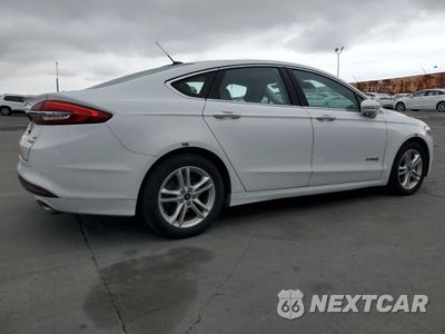 Trzecie zdjęcie samochodu z tyłu: 2018 FORD FUSION SE HYBRID VIN:3FA6P0LU7JR278728 - miniatura