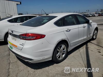Trzecie zdjęcie samochodu z tyłu: 2018 FORD FUSION SE HYBRID VIN:3FA6P0LU5JR171709 - miniatura